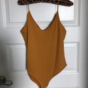 Mustard yellow body suit